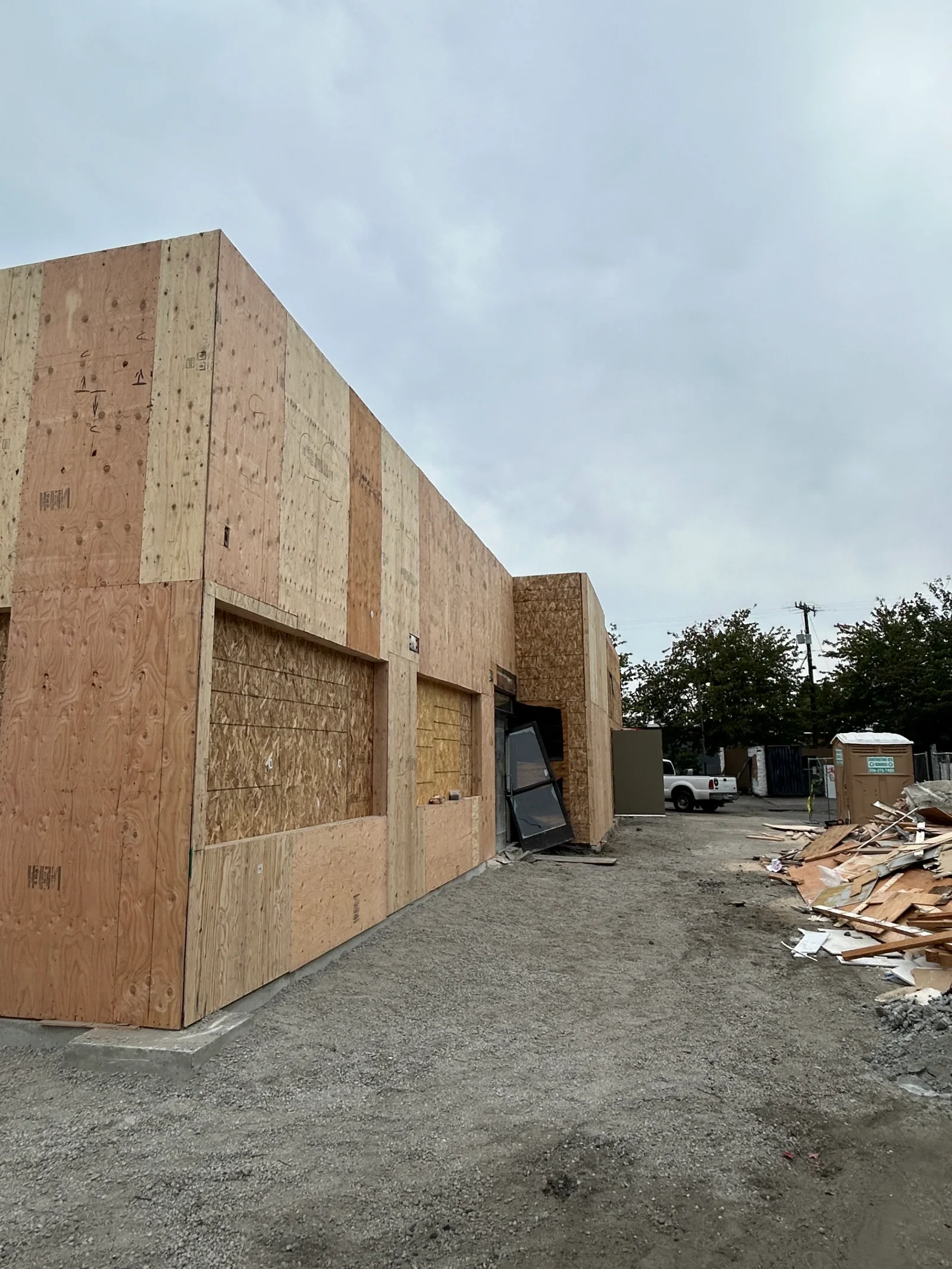 OSB and plywood framed commercial kitchen structure with service door openings